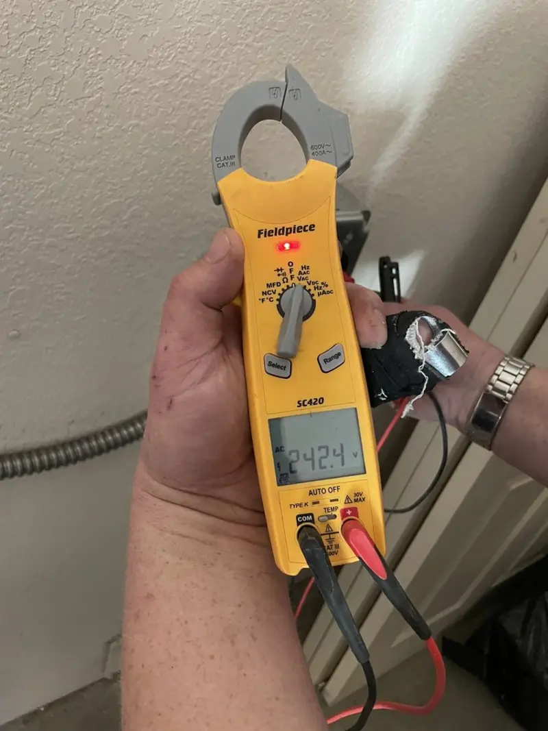 Voltage testing with clamp meter during Ceiling Fan Installation in Berrien